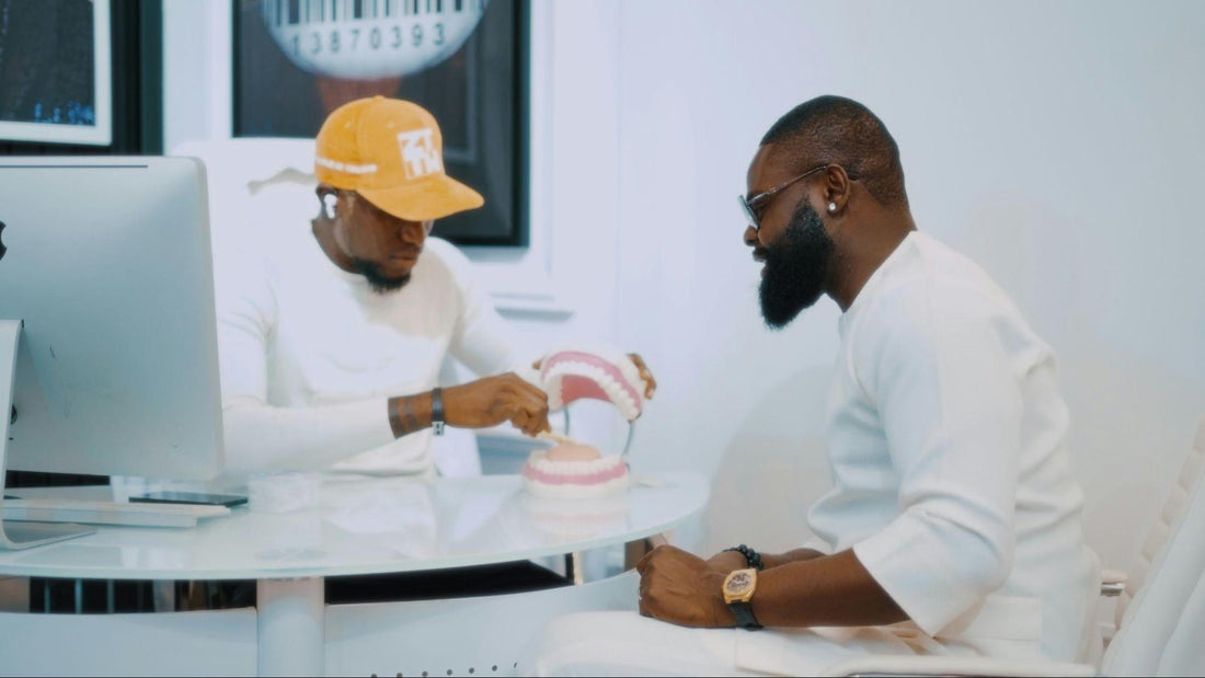 The Future of Cosmetic Dentistry - A dentist explaining to his patient how to brush his teeth