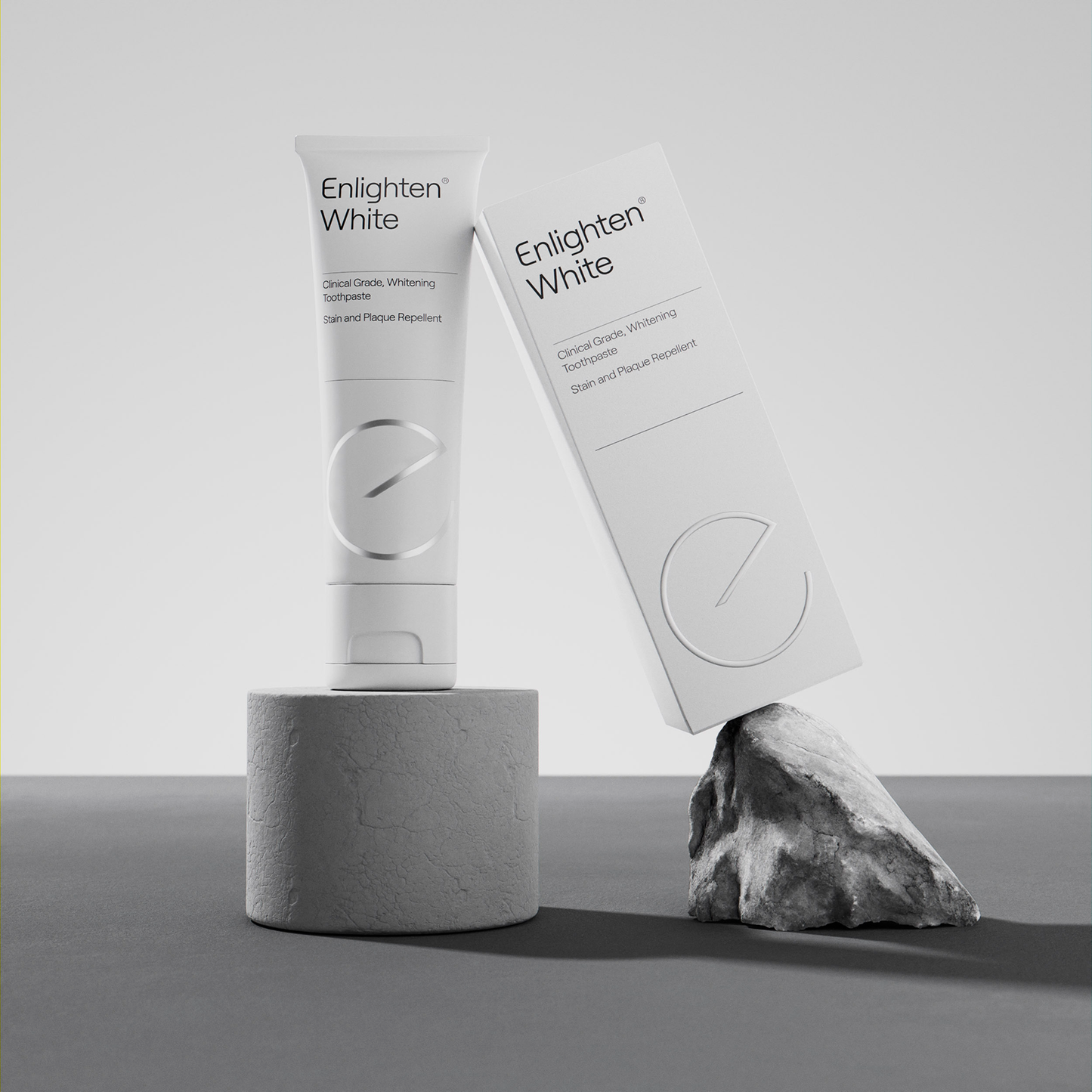 Enlighten White toothpaste tube and box on display.