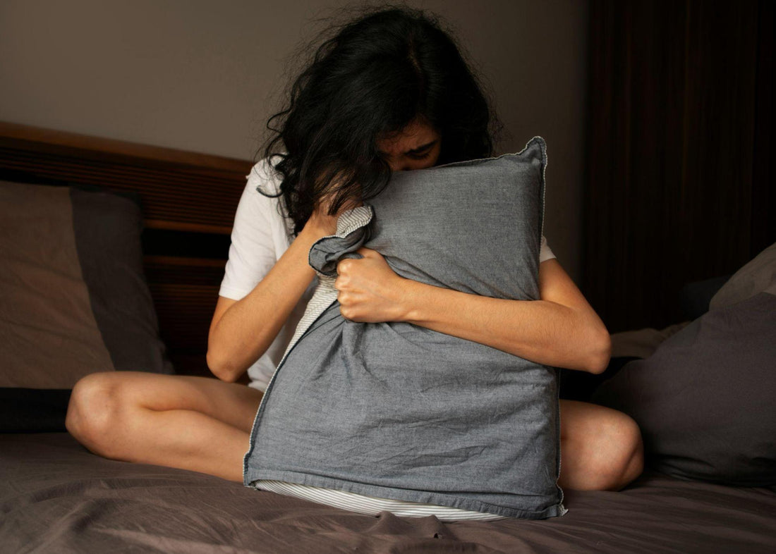 Sleep Disorders and Dental Health - a woman standing in her bed while hugging a pillow