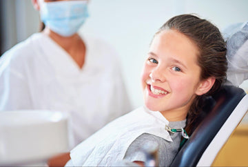 A teen having teeth whitening - Teeth Whitening for Teens: All the Pros & Cons - Enlighten