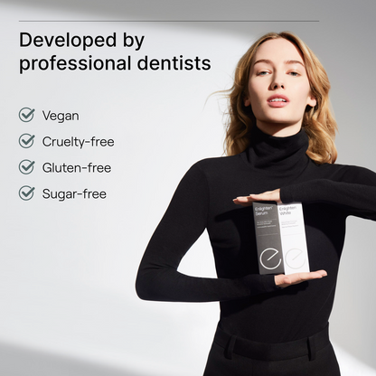 Woman holding Enlighten Serum and White displaying they are vegan, cruelty, gluten and sugar free